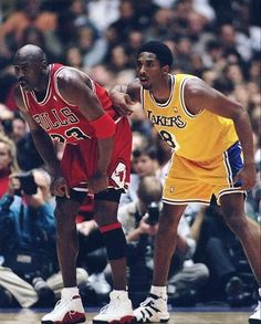 two basketball players standing next to each other