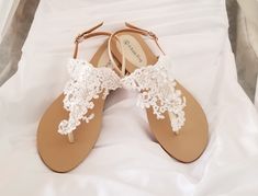 White lace bridal sandals are designed with feminine lace design. They are perfect for your Destination Wedding or a comfortable alternative for traditional brides. The comfortable wedding sandals are vegan friendly. They are perfect for wearing at your reception so you can dance the night away in comfort! After the wedding wear them all summer long. The lace is white and the sandal straps are an off white/neutral color. Additional beach inspired items can be found in my shop http://www.etsy.com Lace Open Toe Sandals For Weddings, White Lace Wedding Sandals, Blue Wedding Sandals, Lace Wedding Sandals, Beach Wedding Sandals, Beach Wedding Shoes, Vegan Sandals, Ivory Wedding Shoes, Wedding Dress Sequin