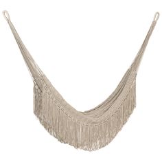 a white hammock with fringes hanging from it's side on a white background