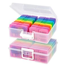 two plastic storage boxes with dividers and lids filled with colored pencils on white background