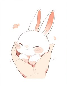 a hand holding a small white rabbit in it's palm, with its eyes closed