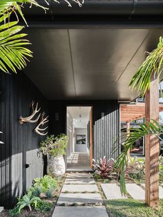 an entry way leading to a black house