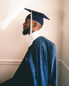 a man wearing a graduation cap and gown