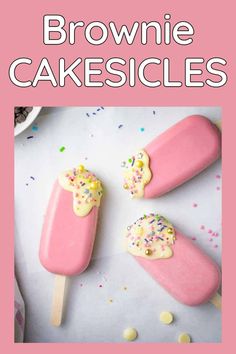 brownie cakesicles with sprinkles are on a white table and pink background