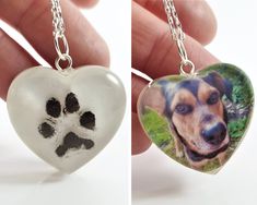 two pictures of a dog's paw and heart shaped necklaces, one is being held by a hand