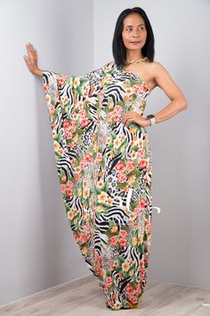 "Off the shoulder boho chic maxi dress with floral print a one shoulder long sleeve dress for women with animal and flower print PRODUCT SIZE : Free Size * Chest : 40\" will stretch to 44\" * Waist : 40\" will stretch to 44\" * Hips : 40\" will stretch to 44\" * Sleeve length : 23\" * Length : 56\" - 57\" from shoulder to hem (measured when laying flat) MATERIAL : * Premium ITY polyester > soft and comfortable to wear NOTE : * Model chest : 32\", waist : 24\" hips : 35\" * Combined Height is 5\" Party Maxi Dress With Floral Print And Asymmetrical Neckline, Party One-shoulder Maxi Dress With Floral Print, One-shoulder Floral Maxi Dress For Party, Strapless Printed Maxi Dress For Summer, Summer Strapless Printed Maxi Dress, Chic Asymmetrical Neckline Summer Maxi Dress, Chic Summer Maxi Dress With Asymmetrical Neckline, Spring Beach Cover-up Maxi Dress, Spring Beach Maxi Dress Cover-up