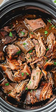 slow cooker pot roast beef with brown gravy and garnishes