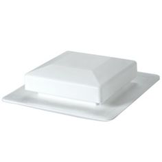 a white plate with a square shaped object on the top and one rectangular piece at the bottom