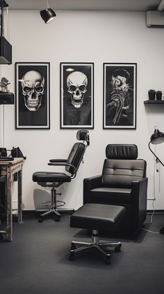 an office with black leather chairs and skulls on the wall above them, along with two framed pictures