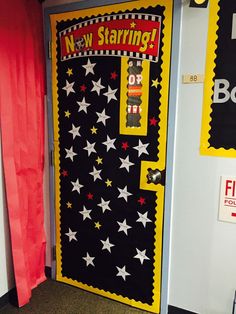 a door decorated with red, white and blue stars in front of a sign that says new starting