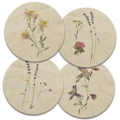 four coasters with flowers painted on them