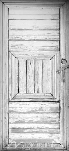 black and white photograph of an open door with wood planks on the outside wall