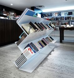 the bookshelf is filled with many different types of books in it's display case