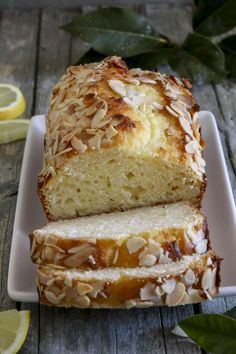 a loaf of lemon almond bread on a white plate