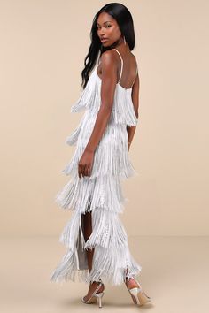 There's no better way to get the party started than the Lulus Get in the Groove Silver Sequin Fringe Bodycon Maxi Dress! This iconic dress boasts alternating layers of dramatic fringe and shiny silver sequins that form a scalloped design across a slinky mesh overlay. Alluring V-neckline, curve-hugging bodycon silhouette, and dancefloor-ready maxi skirt complete the look. Adjustable spaghetti straps. Hidden back zipper/clasp. Fit: This garment fits true to size. Length: Ankle length. Size medium Scalloped Design, Bodycon Maxi Dress, Iconic Dresses, Adhesive Bra, Bodycon Maxi Dresses, Mesh Overlay, Reception Dress, Get The Party Started, Silver Sequin