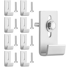 a bunch of white door handles with screws