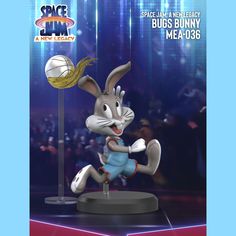 a cartoon bunny is playing basketball on stage