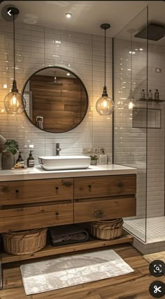 a bathroom with two sinks and a large mirror on the wall above it's counter