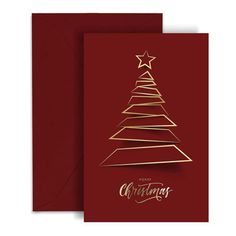 a red christmas card with gold foil on the top and an image of a tree