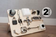 there are two sets of keys in the holder on the table with it's contents