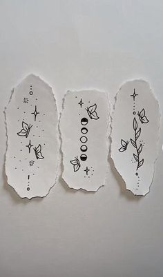 four pieces of torn paper with designs on them