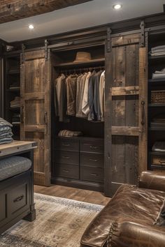 an open closet is shown with leather furniture