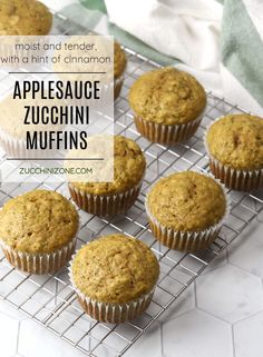 applesauce zucchini muffins on a cooling rack with text overlay