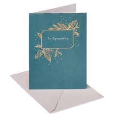 a card with the words in sympathy written on it, and gold foilwork leaves