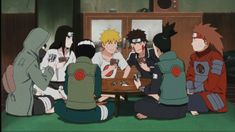 several anime characters sitting around a table together