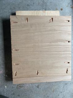 a piece of wood with holes in it