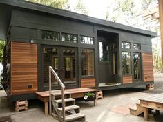 a mobile home with stairs leading up to it