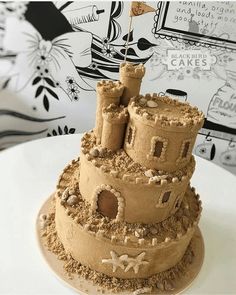 a sand castle cake on a white plate