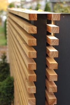 the side of a building with wooden slats on it