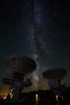 the milky is visible above two satellite dishes