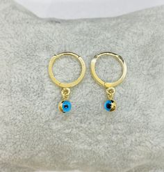 - Two Sided Evil Eye Dangle Drop Earrings for Kids Teen Baby Girls is made with high quality 14K real solid gold. - 14K Real Solid Gold Dangle Drop Earrings is decorated with two sided evil eyes. (Internal diameter of the hoop is 9 mm, evil eye ball size is 4mm. ) - Dainty, delicate, elegant and trendy 14K Gold Two Sided Evil Eye Drop Earrings have been artfully designed for timeless fashion. - You receive dainty evil eye earrings for kids in a beautiful and free gift box - Free shipping (Arrive Adjustable Hypoallergenic Earrings For Birthday, Earrings For Kids, Baby Birthday Gift, Gift For Baby Girl, Snowflake Bracelet, Eye Drop, Eye Ball, Artfully Designed, Baby Earrings