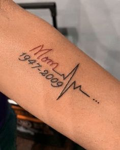 a person with a heartbeat tattoo on their arm