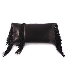 a black leather pillow with fringes on the front and back side, sitting against a white background