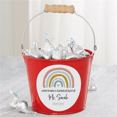 a red bucket filled with lots of candy