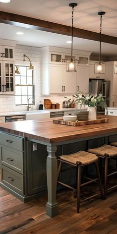 a large kitchen island with stools next to it