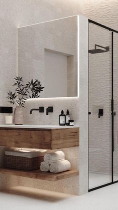 a bathroom with a toilet, sink and shower stall