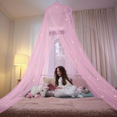 PRICES MAY VARY. CANOPY FIT FOR A PRINCESS: With 46 medium and 23 large glow-in-the-dark stars sprinkled across a pretty, pink mesh netting, this beautiful, magical canopy will truly make any little girl in your life feel like a real princess! The stars—which are made of eco-friendly materials and use advanced adhesive technology to adhere to the net—glisten and glow for a whimsical bed time experience every night. SAFE, FUNCTIONAL, VERSATILE: 100% polyester (a flame-retardant material) with 156 Princess Canopy Walmart, Bed Canopy Pjnk, Canopy Bed Stars, Pink Purple Kids Bedroom, Princess Bedrooms Walmart, Canopy Bed With Lights Kids, Purple And Pink Toddler Bedroom, Canopy For Bed, Pink Bed Canopy