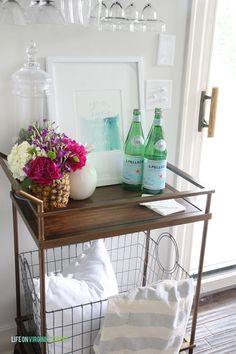 a table with flowers and bottles on it