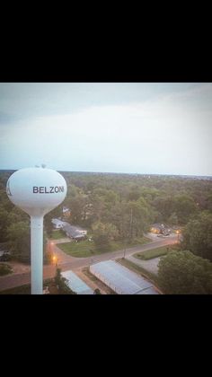 an aerial view of a water tower with the word belzon on it's side