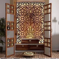 a room divider with a buddha statue in it