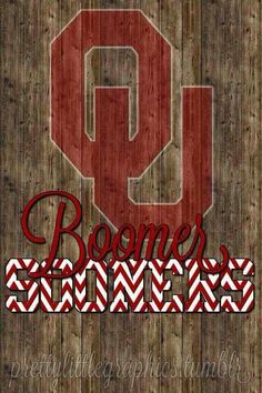 the word boomers cheer written in red and white chevrons on a wooden background