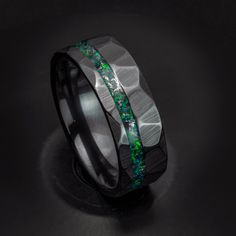 This sleek black ceramic ring has real meteorite shavings mixed with Black Emerald Lab opal! The meteorite in this ring has shavings collected from making meteorite rings, the meteorites are found in the Muonionalusta Meteorite field in Sweden. Black Ceramic is a great choice for a ring because it is incredibly hard, so hard that it takes a diamond to scratch it! The material is also black all the way through, which is much better than most tungsten coated rings because the black will never come Meteorite Rings, Red Opal, Emerald Rings, Meteorite Ring, Ceramic Ring, Unique Gifts For Men, Ceramic Rings, Green Copper, Fiery Red