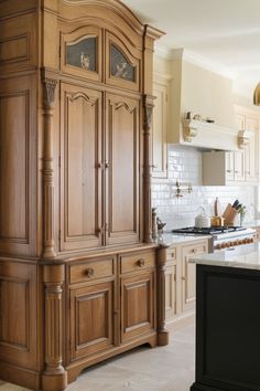 A cozy, traditional kitchen with a mix of warm wood and blue-green cabinets, vintage-inspired light fixtures, and a subway tile backsplash. Timeless Kitchen Cabinets, Timeless Kitchen, Kitchen Cabinet Styles, Cabinet Styles