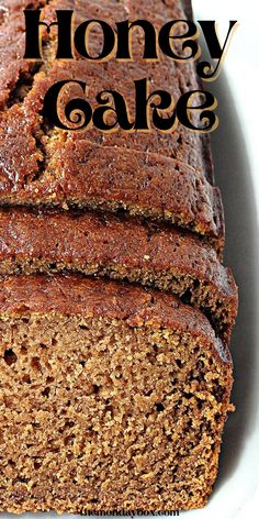 a loaf of honey cake on a plate with the title in the middle above it