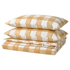 three pillows stacked on top of each other in yellow and white checkered pattern,