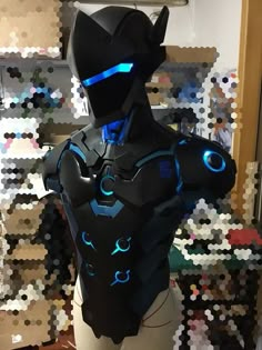 a mannequin made out of legos with blue lights on it's chest